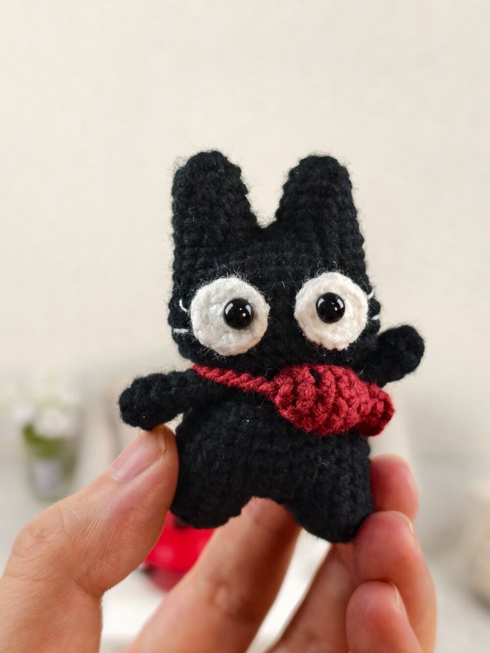 Handmade Amigurumi Crochet Cat Carrying A Red Fish Plushie